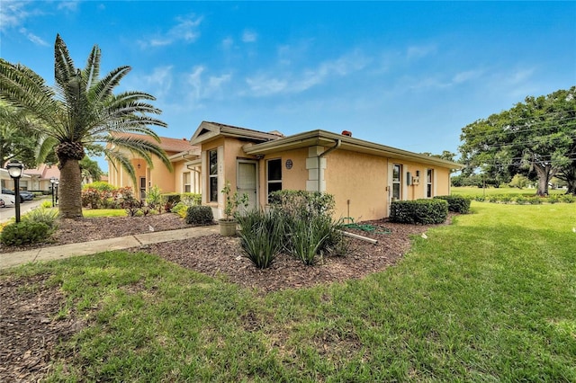 view of property exterior featuring a lawn