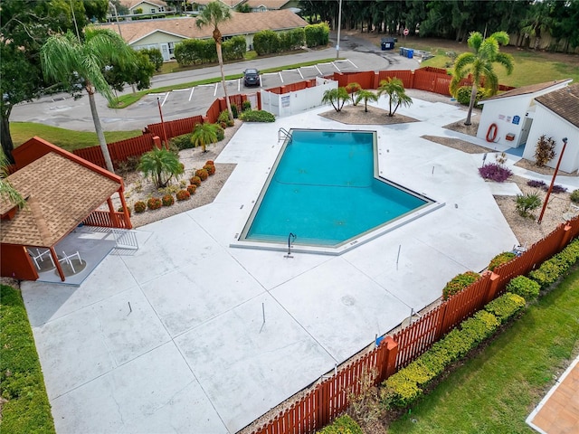 view of pool with a patio area, a gazebo, and an outdoor structure