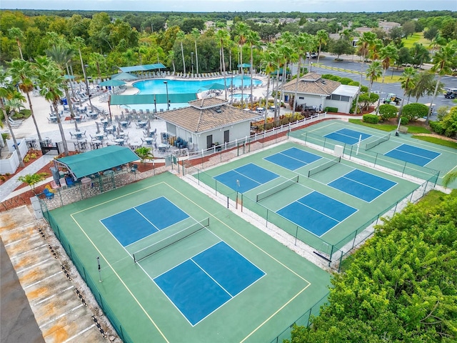 view of sport court featuring a community pool