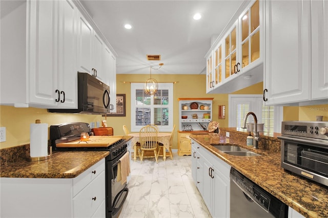 kitchen with black appliances, white cabinetry, a healthy amount of sunlight, and sink