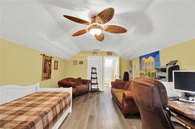 bedroom featuring lofted ceiling, ceiling fan, and light hardwood / wood-style floors