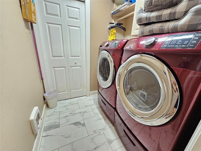 clothes washing area with washer and dryer