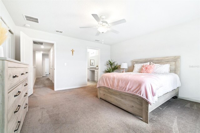 carpeted bedroom with ceiling fan and connected bathroom