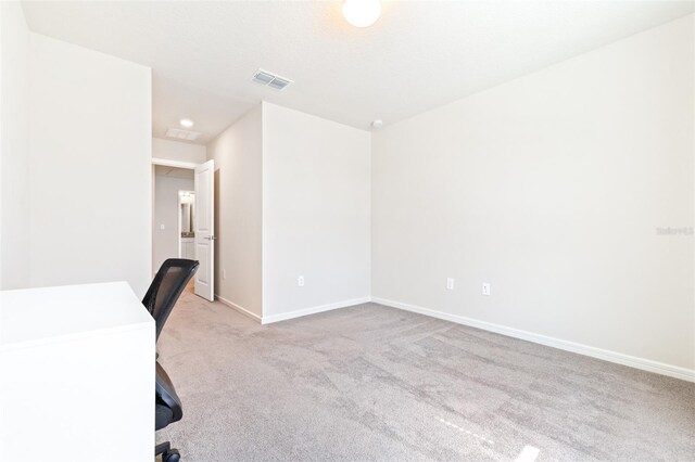 unfurnished office with light colored carpet