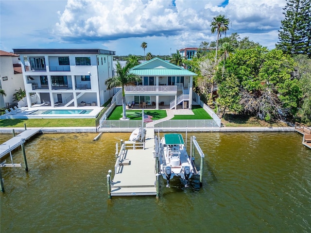 view of dock with a balcony, a water view, and a patio