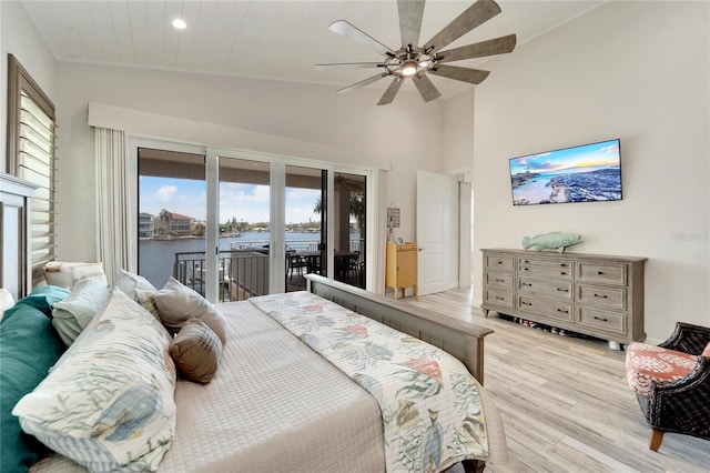 bedroom featuring high vaulted ceiling, ceiling fan, access to exterior, and light hardwood / wood-style flooring