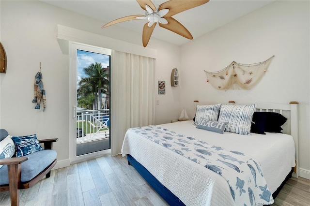 bedroom featuring light hardwood / wood-style floors, ceiling fan, and access to exterior