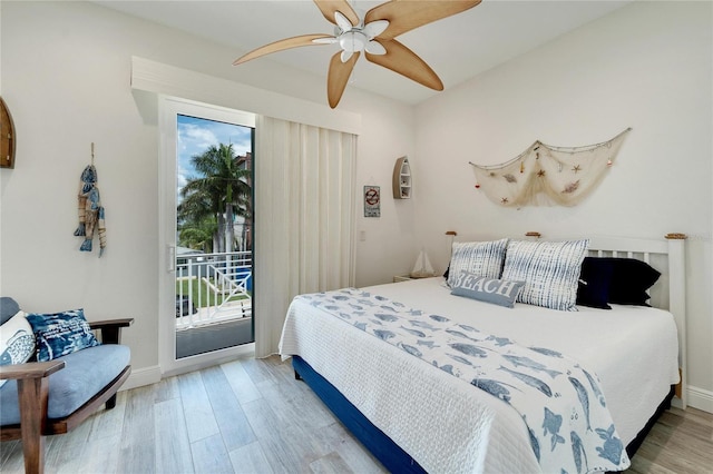 bedroom with a ceiling fan, access to outside, baseboards, and wood finished floors