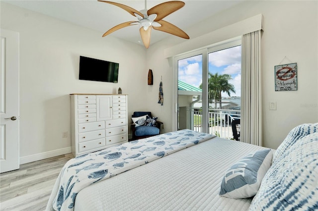 bedroom featuring access to outside, baseboards, ceiling fan, and light wood finished floors