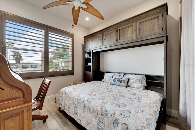 bedroom with recessed lighting, ceiling fan, light wood finished floors, and baseboards