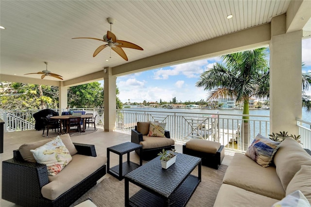 view of patio with ceiling fan, an outdoor hangout area, and a water view