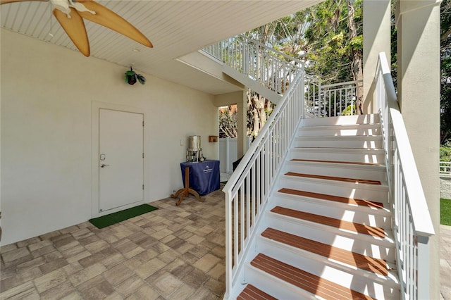 interior space with ceiling fan and a patio