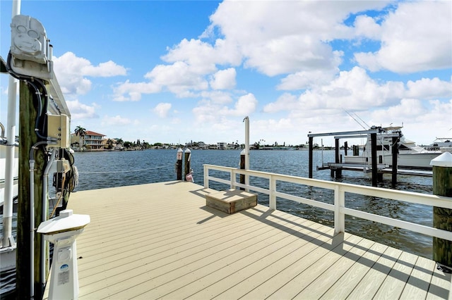 view of dock featuring a water view and boat lift