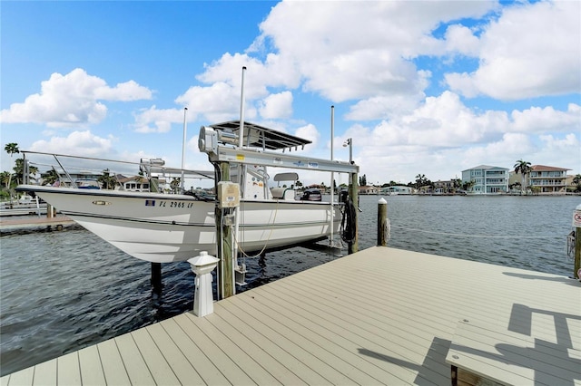 view of dock with a water view and boat lift