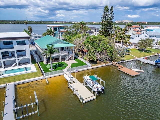 drone / aerial view with a residential view and a water view