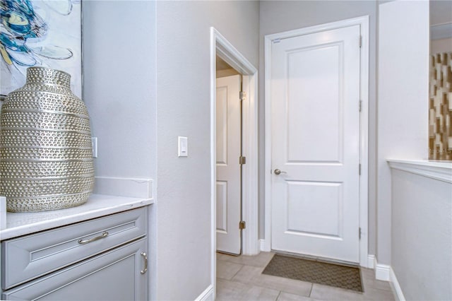 interior space featuring vanity and tile patterned floors