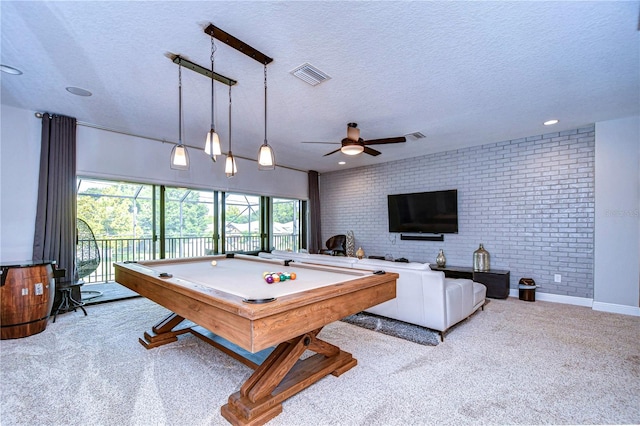 playroom with pool table, ceiling fan, carpet floors, and brick wall