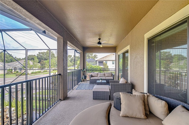 sunroom featuring a wealth of natural light and ceiling fan