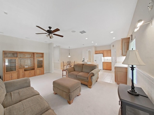 living area with visible vents, ceiling fan, light colored carpet, light tile patterned floors, and recessed lighting