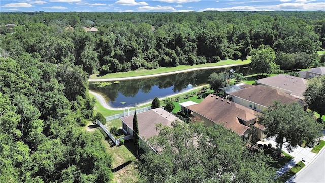 aerial view featuring a view of trees and a water view