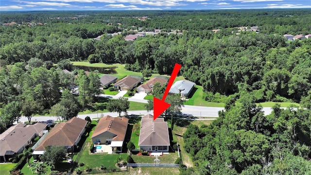 birds eye view of property with a residential view and a forest view