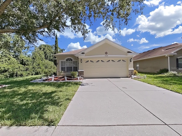 ranch-style home with a front lawn and a garage