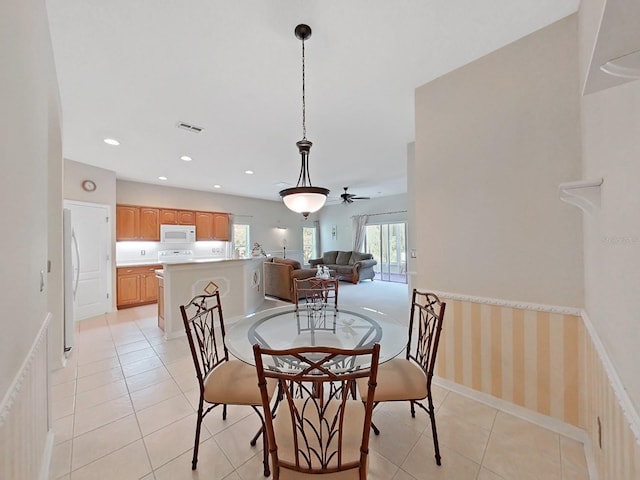 dining room featuring light tile patterned flooring, recessed lighting, visible vents, and baseboards