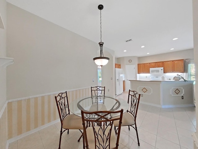 dining area with light tile patterned floors, recessed lighting, visible vents, and a healthy amount of sunlight