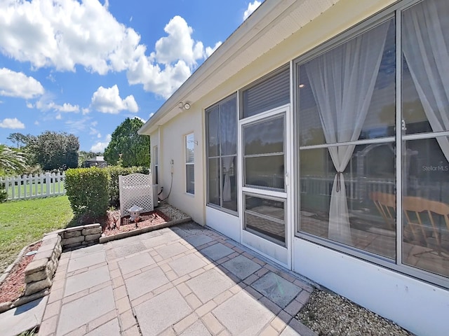 view of patio featuring fence