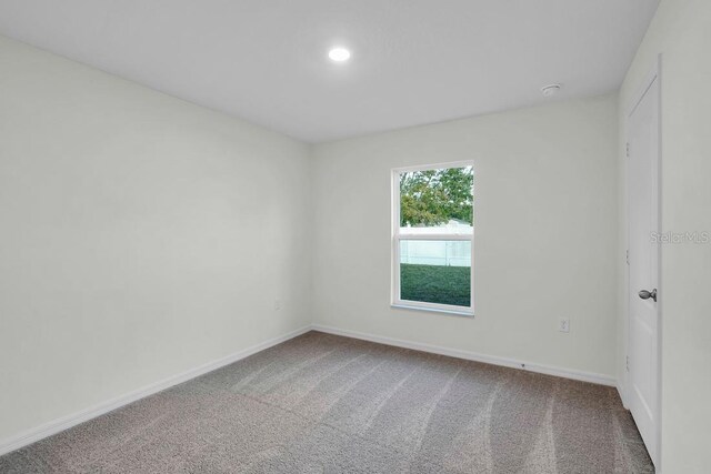 view of carpeted spare room