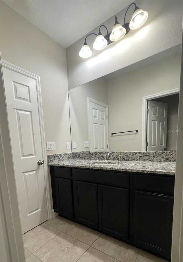 bathroom featuring tile patterned floors and vanity