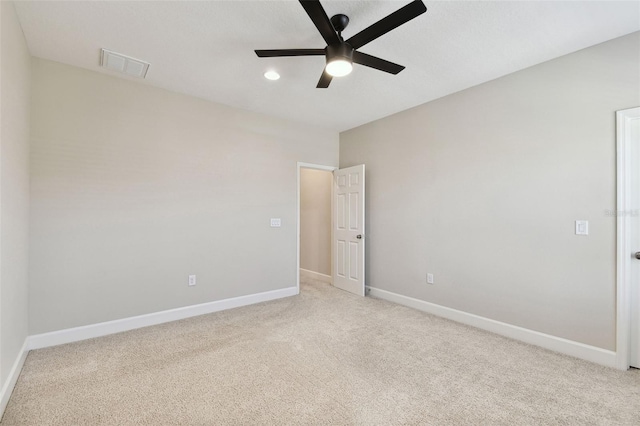 carpeted empty room with ceiling fan