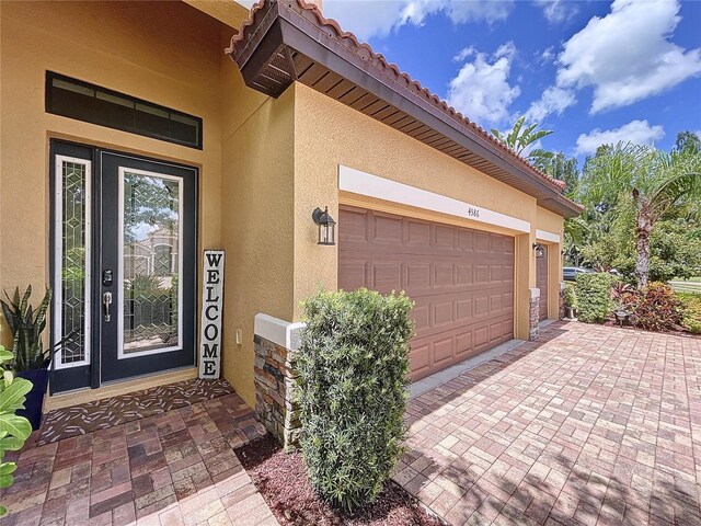 property entrance with a garage