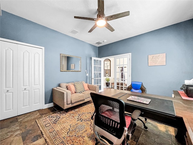 office featuring french doors, a textured ceiling, and ceiling fan