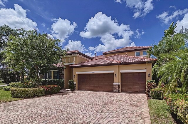 mediterranean / spanish-style house featuring a garage