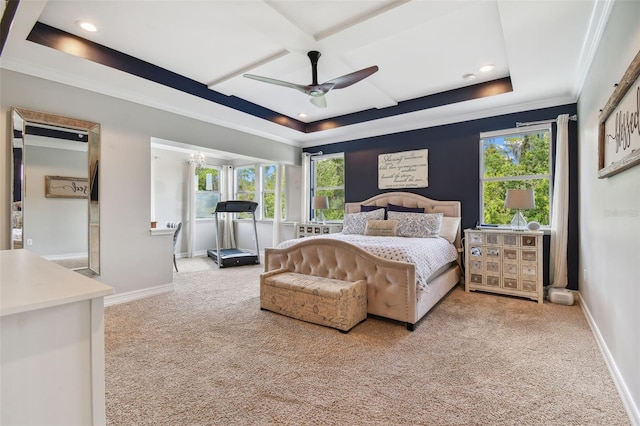 bedroom featuring a tray ceiling, ornamental molding, light carpet, and ceiling fan