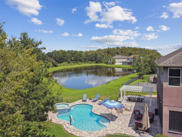 view of pool featuring a yard, a patio, an in ground hot tub, and a water view