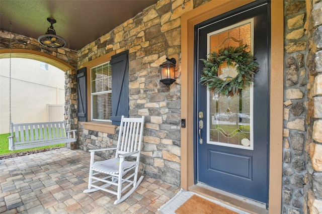 property entrance with covered porch