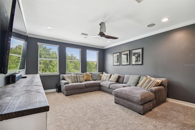 living room featuring carpet flooring, ornamental molding, and ceiling fan