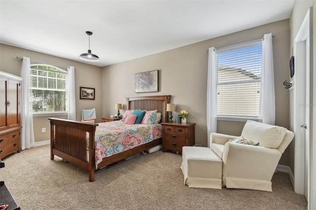 bedroom with light colored carpet