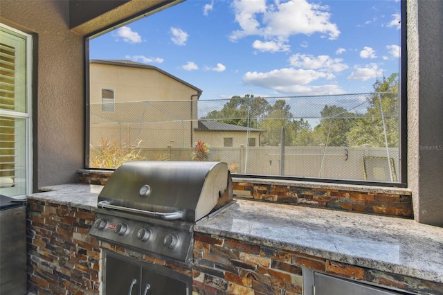 view of patio / terrace with exterior kitchen and area for grilling