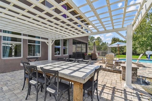 view of patio featuring a pergola and an outdoor fire pit