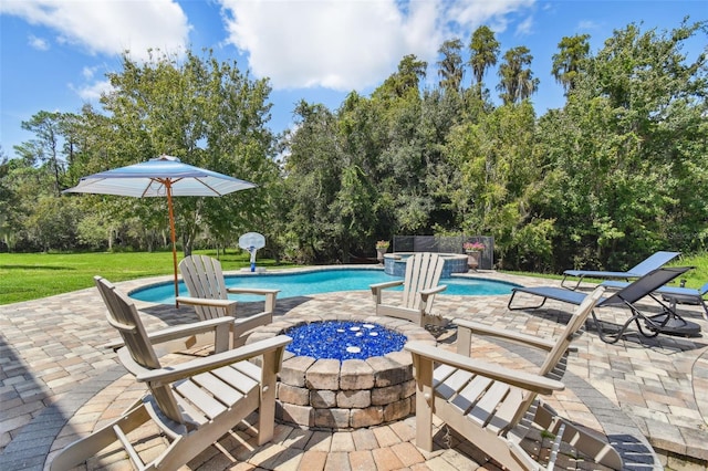 view of swimming pool featuring a lawn and a patio area