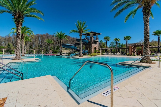 view of pool with a water slide