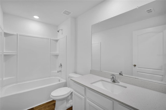 full bathroom featuring shower / tub combination, wood-type flooring, toilet, and vanity