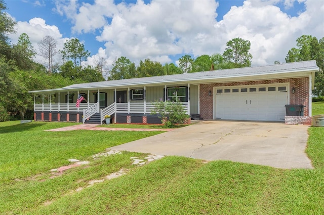 single story home featuring a front lawn, a garage, and covered porch