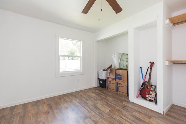 misc room with ceiling fan and dark hardwood / wood-style flooring