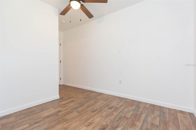 empty room with ceiling fan and wood-type flooring