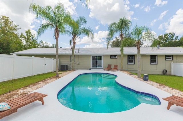 view of swimming pool with central AC and a patio