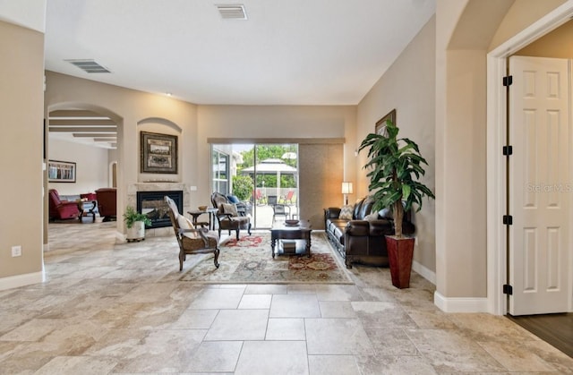 living room with a premium fireplace